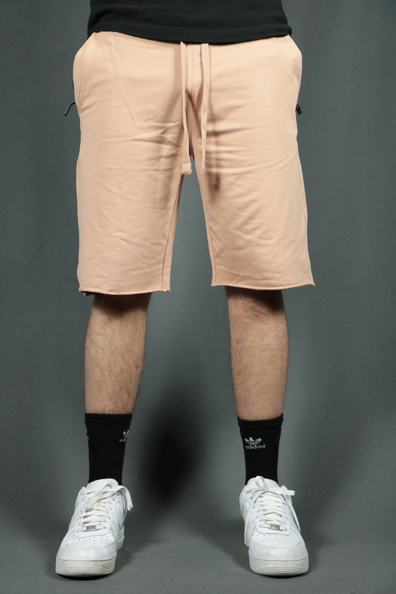 The blush men's toweling shorts made from terry cloth by Jordan Craig.