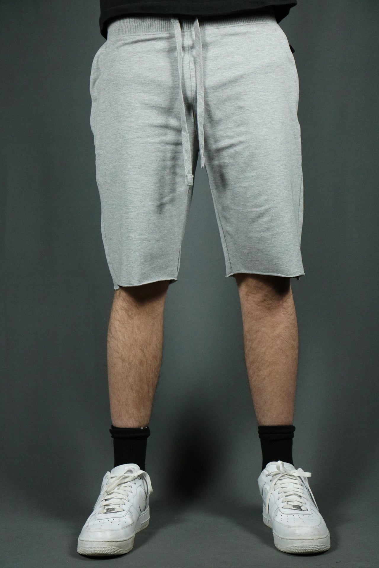 A pair of heather grey terry cloth shorts by Jordan Craig.