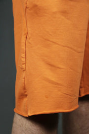 The orange terry towel shorts by Jordan Craig. 