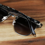 The Round Frame Black Gradient Lens Sunglasses with Black Tortoise Silver Frame folded up