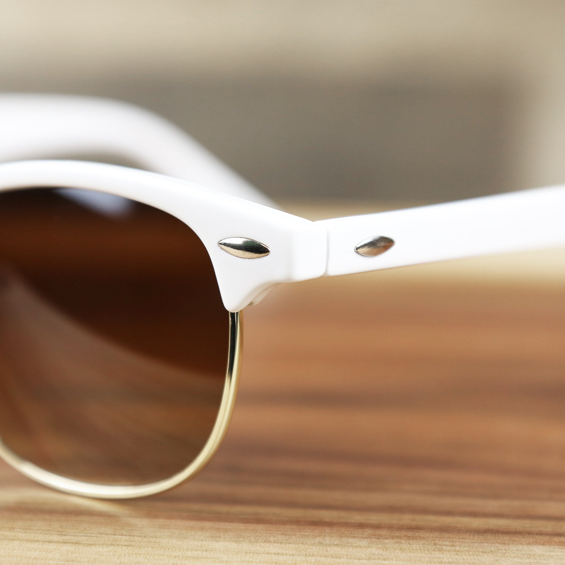 The hinge on the Round Frame Brown Gradient Lens Sunglasses with White Gold Frame