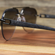 The arms of the Round Aviator Frames Black Lens Sunglasses with Gold Frame