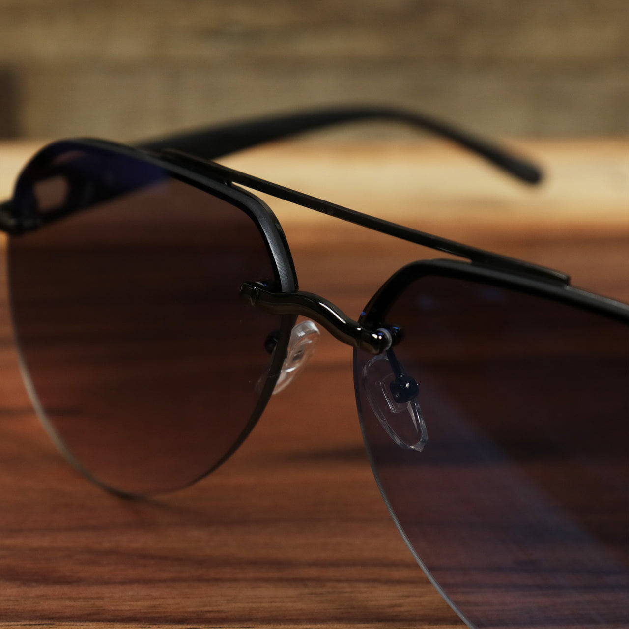 The bridge on the Round Aviator Frames Black Lens Sunglasses with Gold Frame