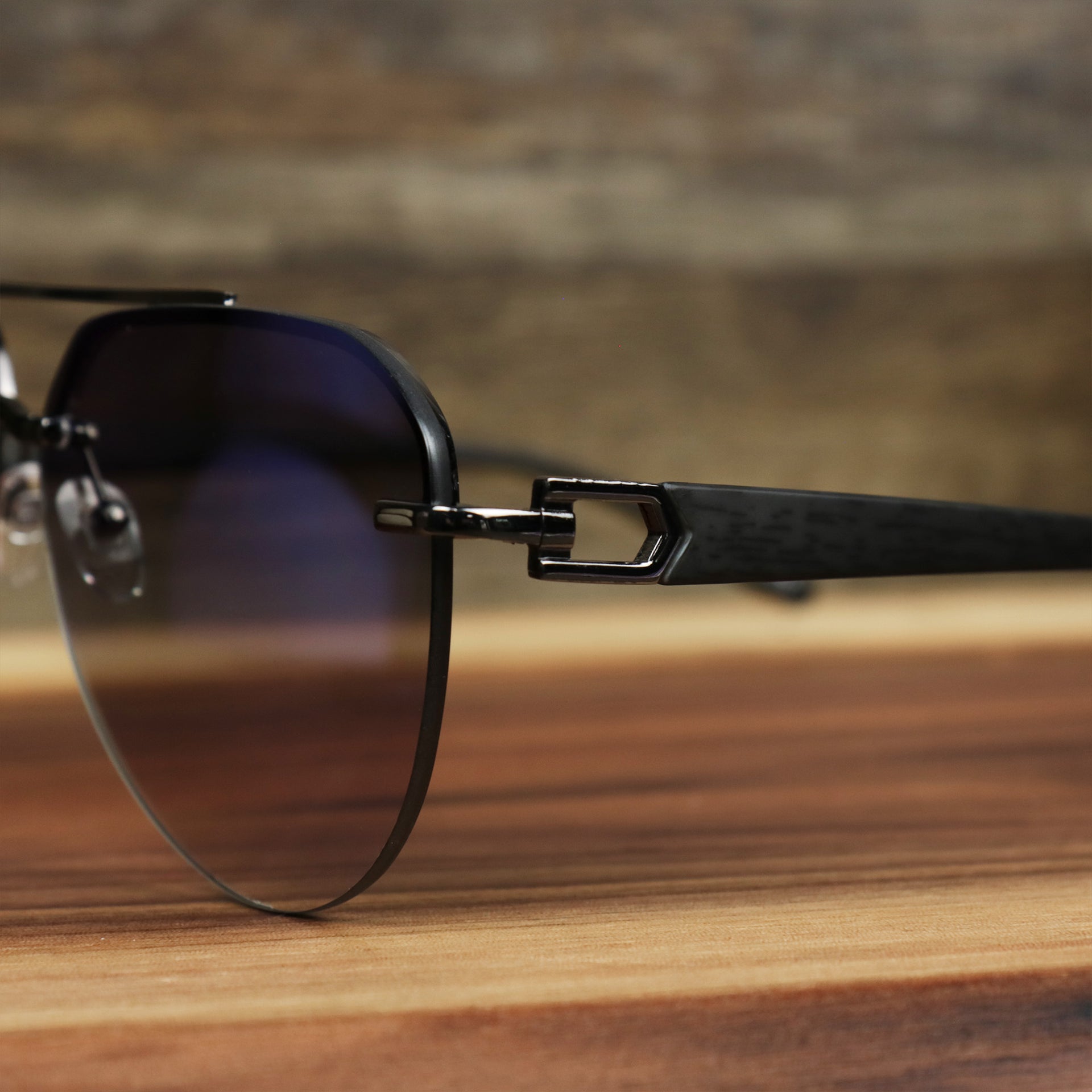 The hinge on the Round Aviator Frames Black Lens Sunglasses with Gold Frame