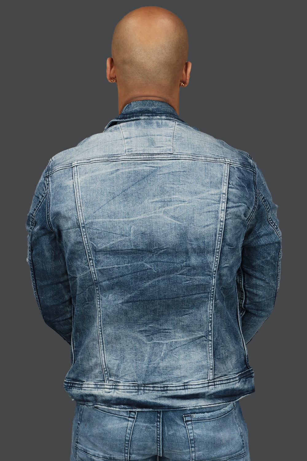 The backside of the Deep Blue Distressed Denim Jacket | Jordan Craig