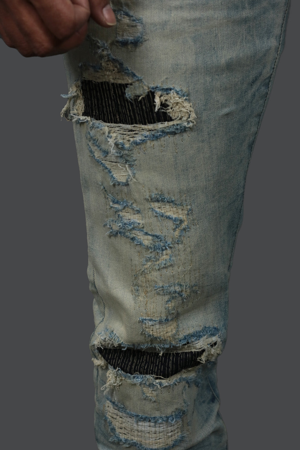The ripped legs on the Iced Lager Distressed Denim Pants | Jordan Craig