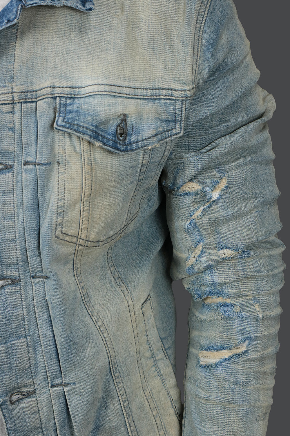 a close up of the other arm on the Iced Lager Distressed Denim Jacket | Jordan Craig