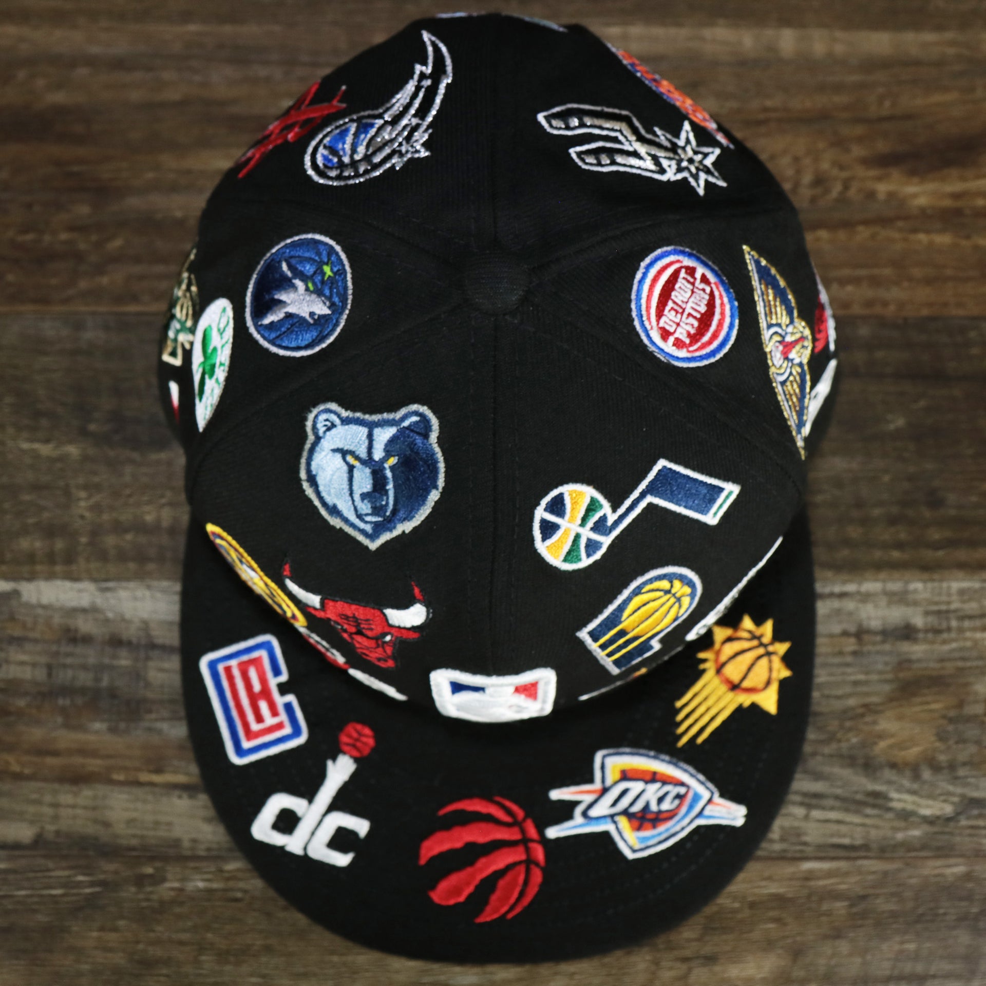 An overhead shot of the NBA Logo All Over patch fitted 59Fifty Cap with Gray Bottom | Black