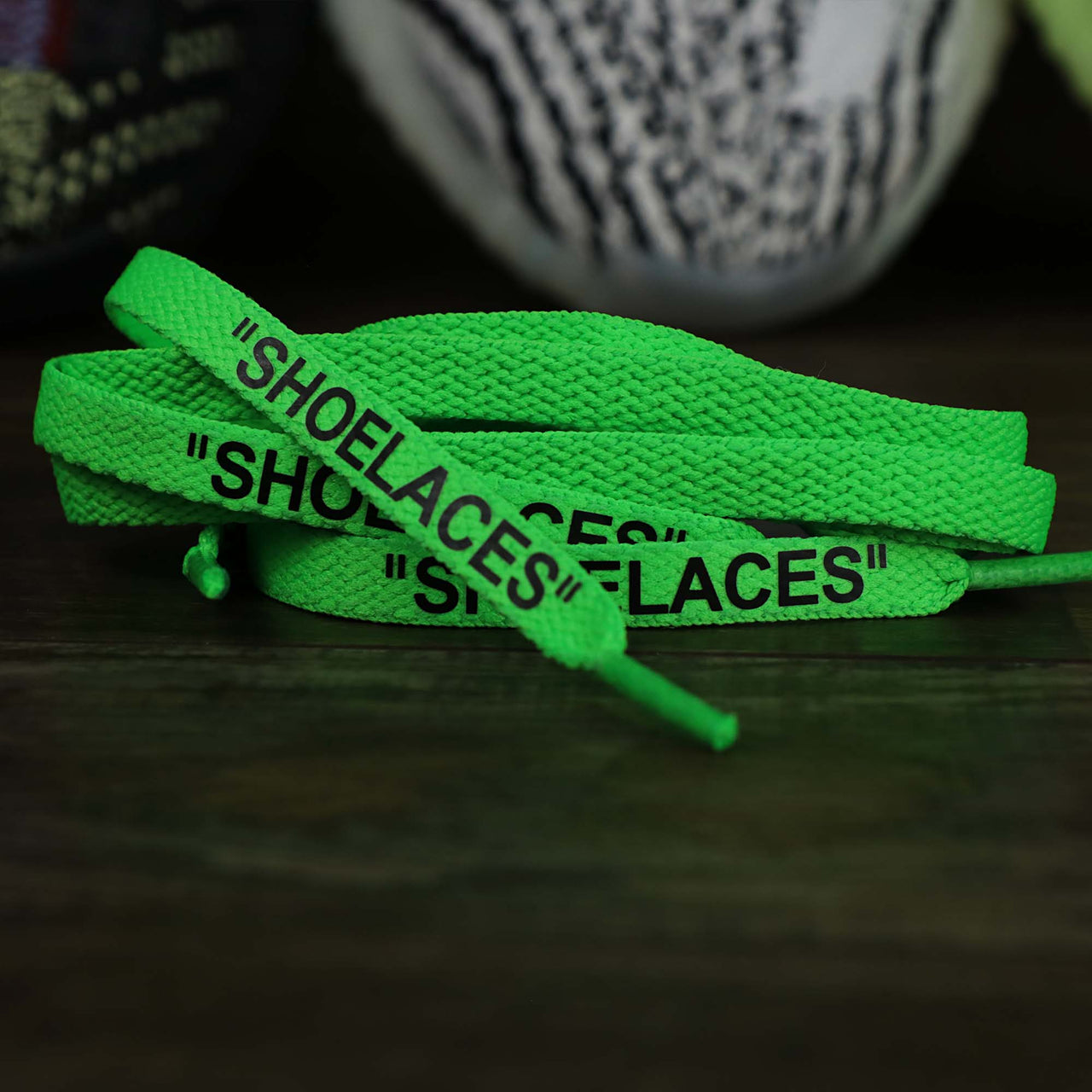The Flat Neon Green Shoelaces with “Shoelaces” Print | 120cm Capswag unfolded