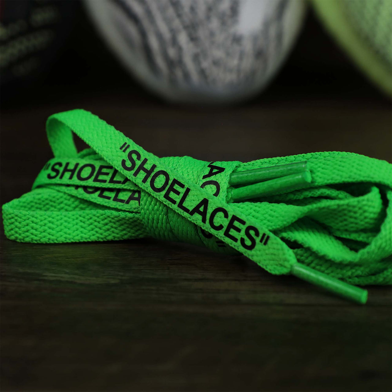 The Flat Neon Green Shoelaces with “Shoelaces” Print | 120cm Capswag