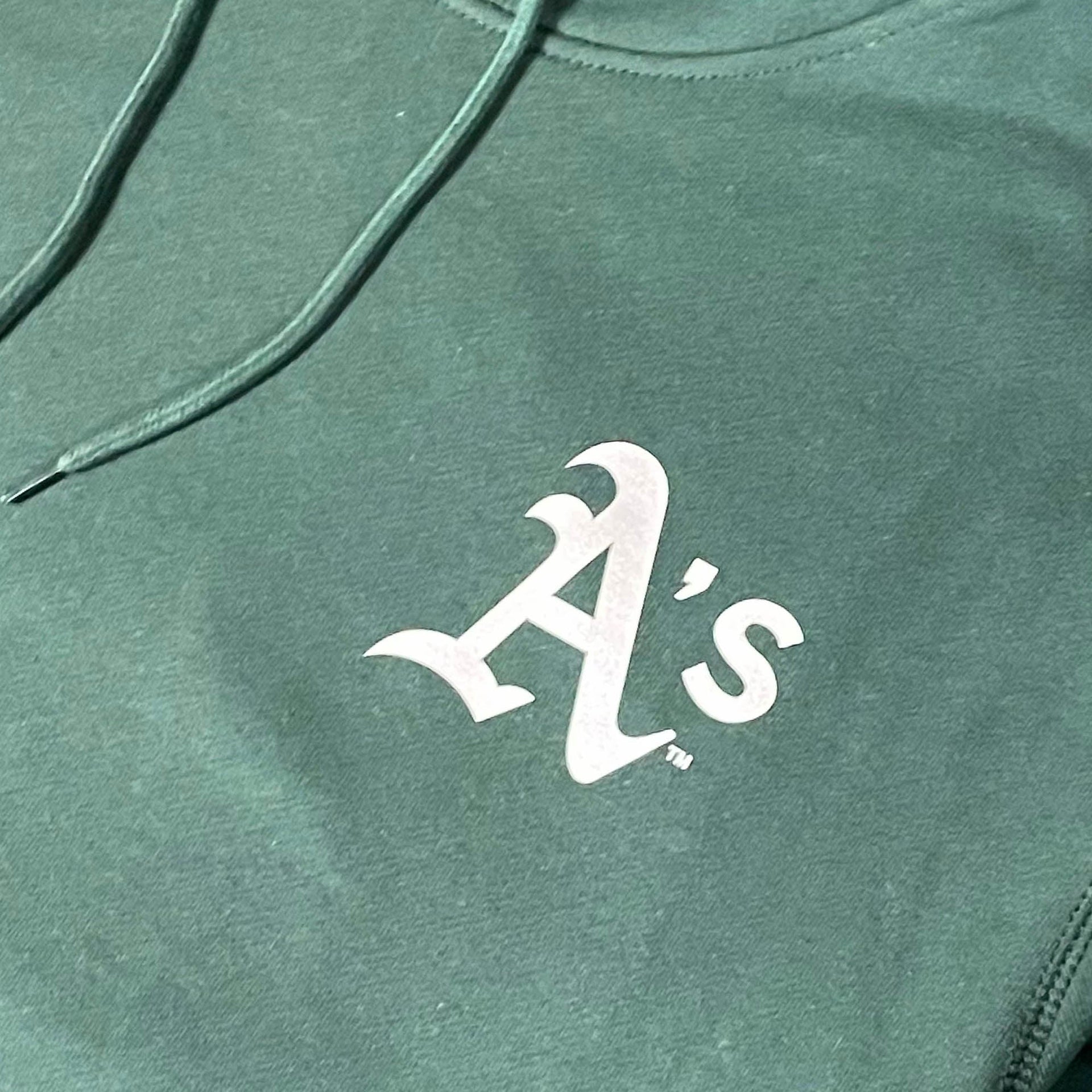 Close up of the Athletics logo on the Oakland Athletics "City Cluster" 59Fifty Fitted Matching Green Pullover Hoodie
