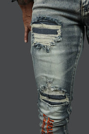 A close up of the holes on the Only The Strong Custom Spray Painted Distressed Denim Pants Motive Denim | Vintage | 