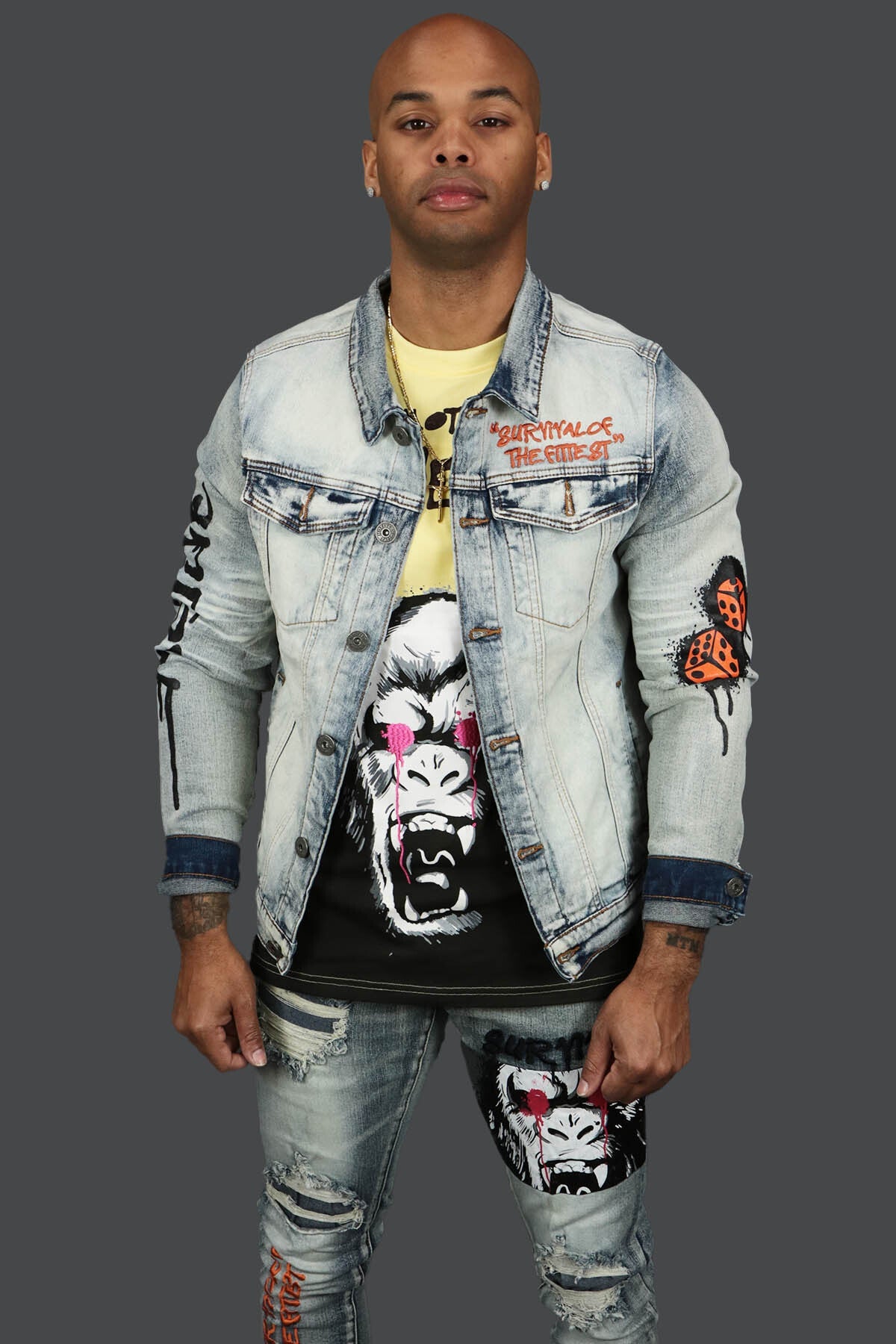 The front of the Only The Strong Custom Spray Painted Denim Jacket Motive Denim | Vintage |  with matching Only The Strong Graphic Tee fromMotive Denim and Motive Denim Custom Graphic Denim Jeans.