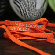 The Flat Orange Shoelaces with “Shoelaces” Print | 120cm Capswag unfolded