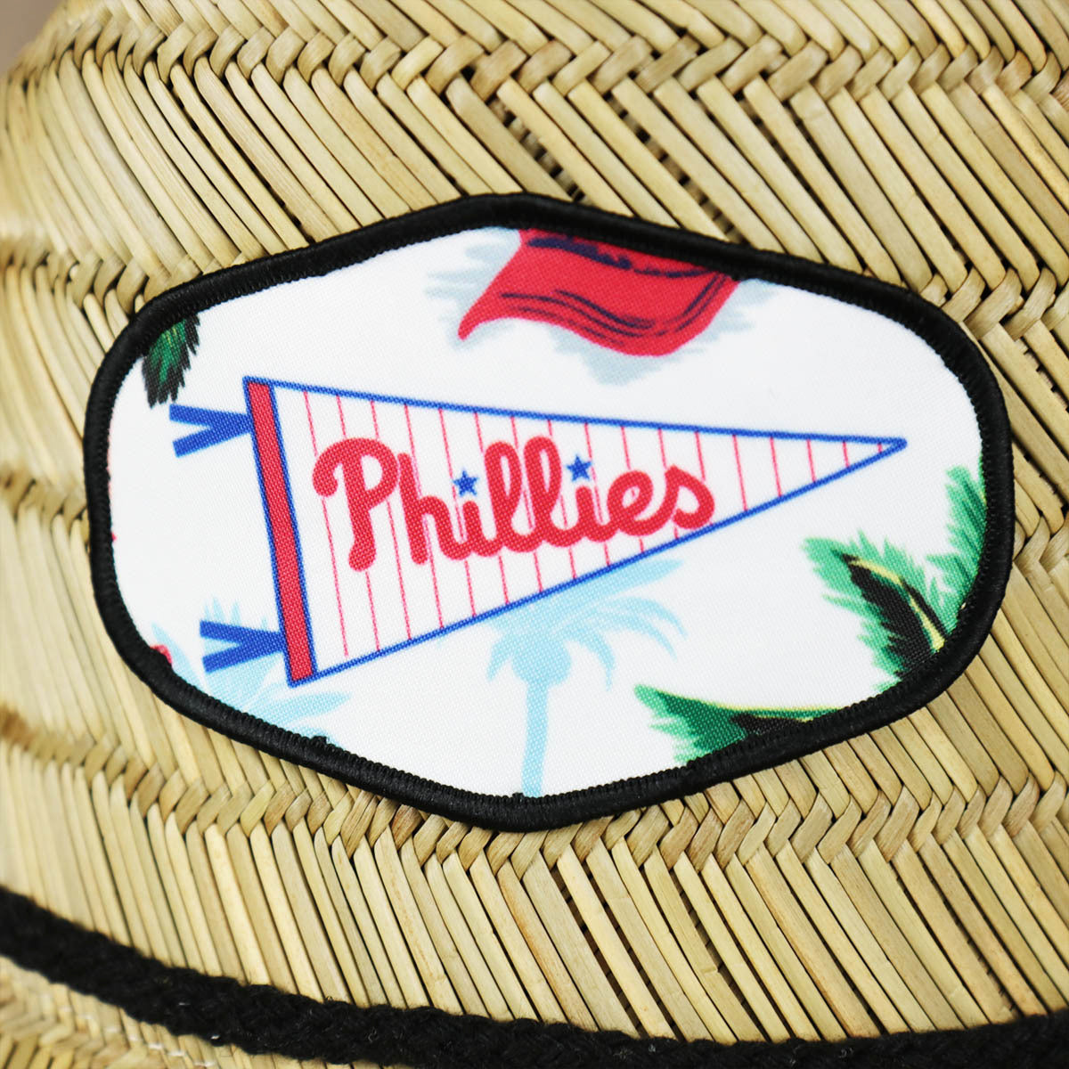 A close up of the Phillis emblem on the Philadephia Phillies Straw Life Guard Hat Reyn Spooner