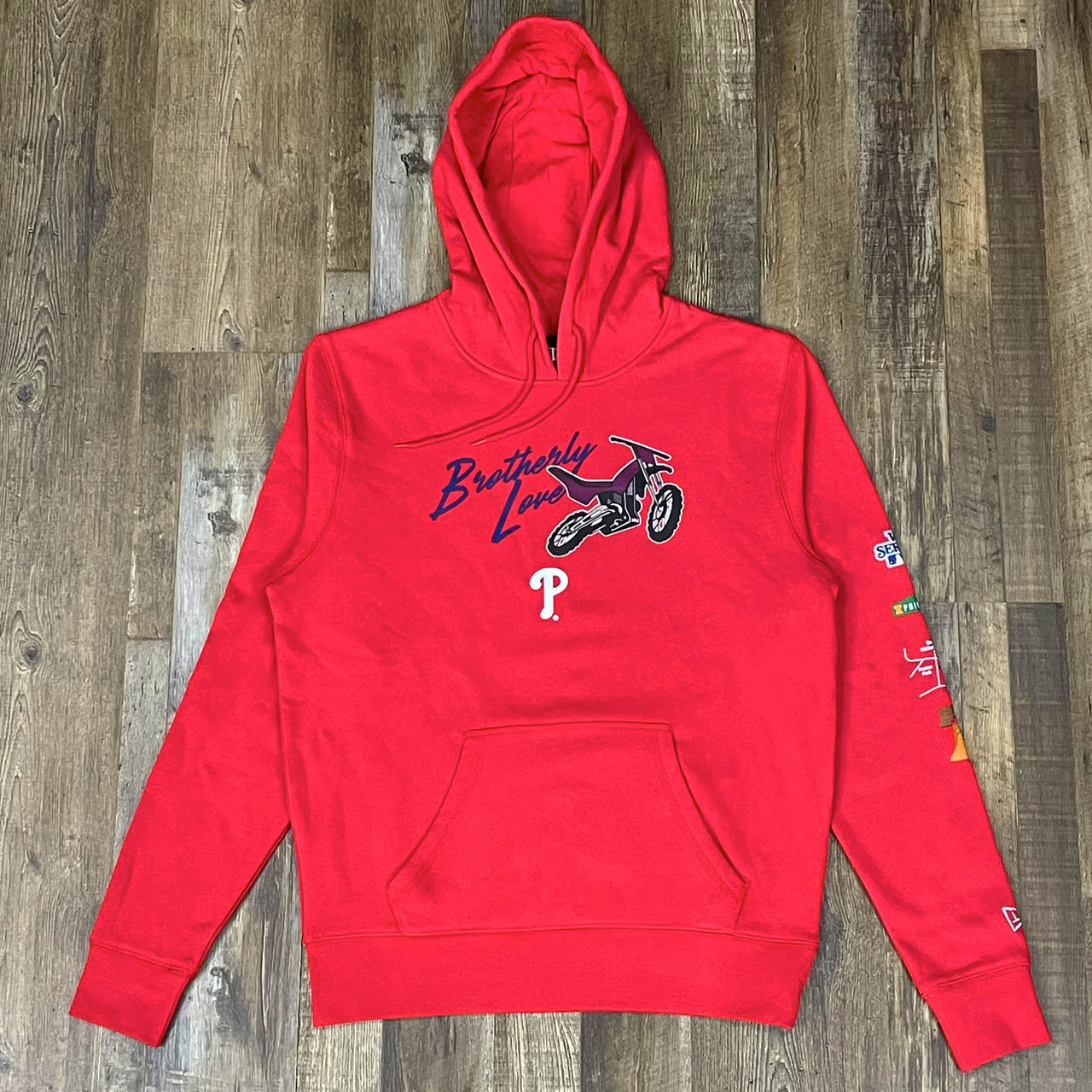front of the Philadelphia Phillies "City Transit" 59Fifty Fitted Matching Red Pullover Hoodie