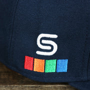 Spectrum logo on the Philadelphia 76ers 2021 Retro Spectrum City Edition Gray Bottom 9Fifty Snapback | Navy