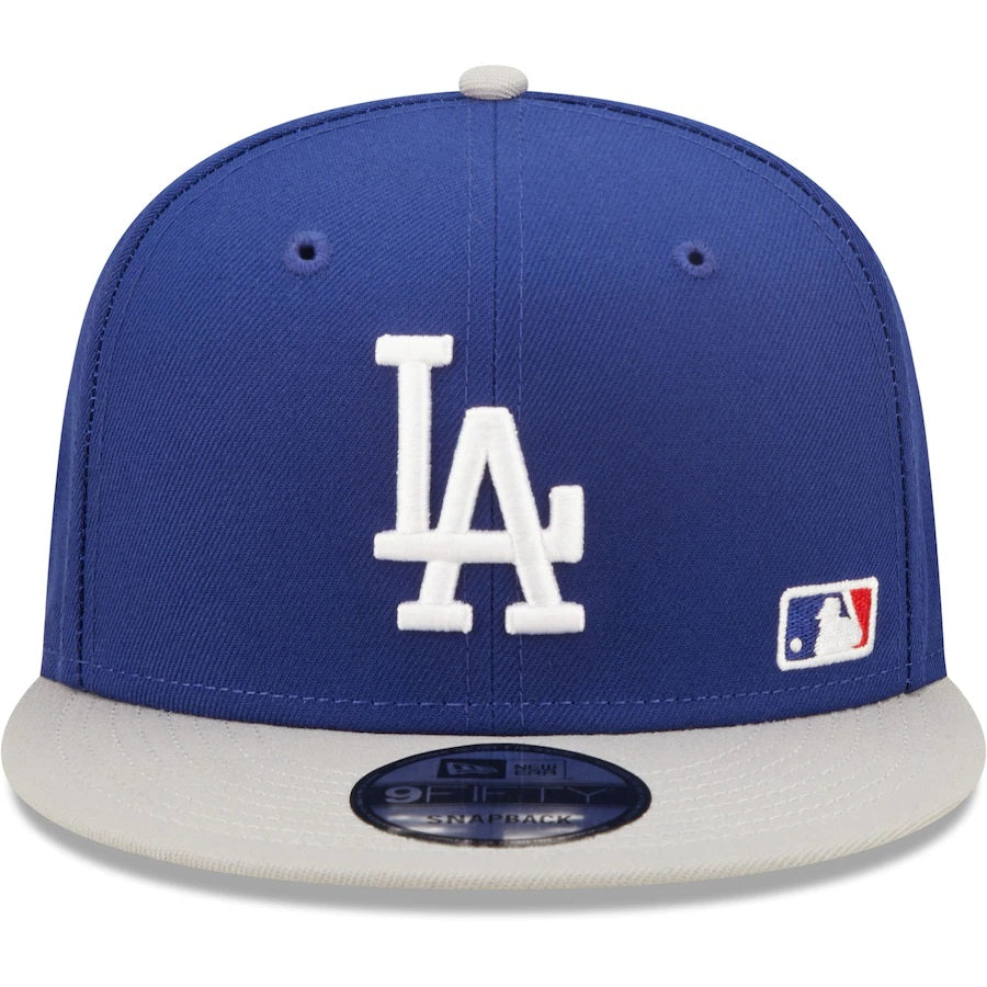 The front of Los Angeles Dodgers Silver Letter Arch Retro Green Bottom 9Fifty Snapback Cap | Back Letter Arch Blue 9Fifty