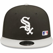 The wearer's left on the Chicago White Sox Silver Letter Arch Retro Green Bottom 9Fifty Snapback Cap | Back Letter Arch Black 9Fifty