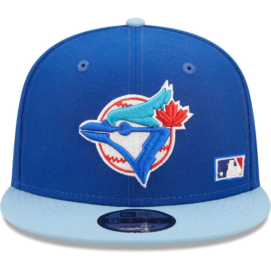 The front of Toronto Blue Jays Cooperstown Green Bottom Light Blue Letter Arch 9Fifty Snapback Cap | Back Word Arch Royal Blue 9Fifty