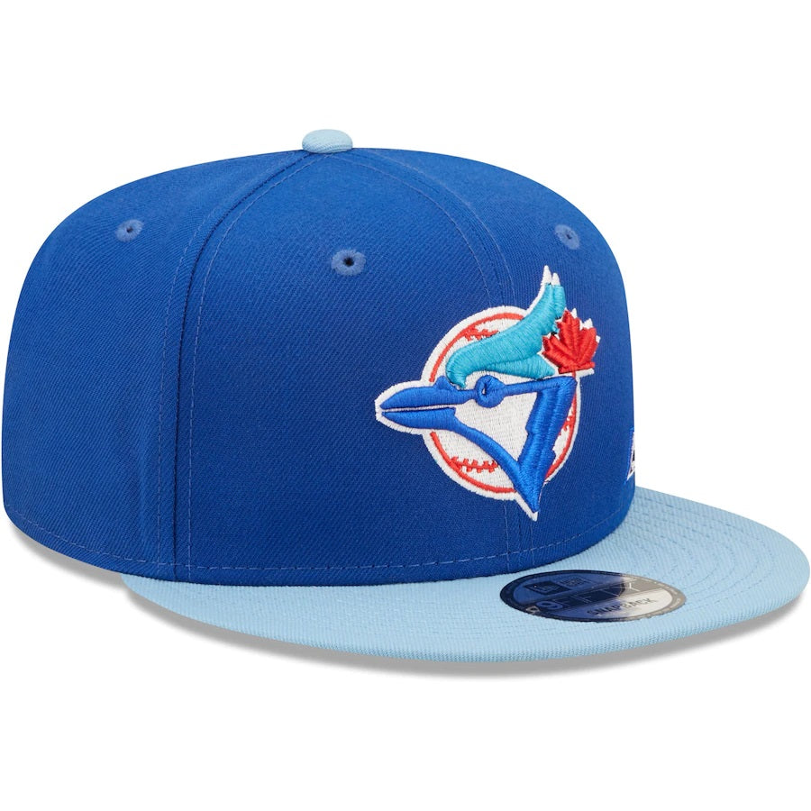 The Toronto Blue Jays Cooperstown Green Bottom Light Blue Letter Arch 9Fifty Snapback Cap | Back Word Arch Royal Blue 9Fifty