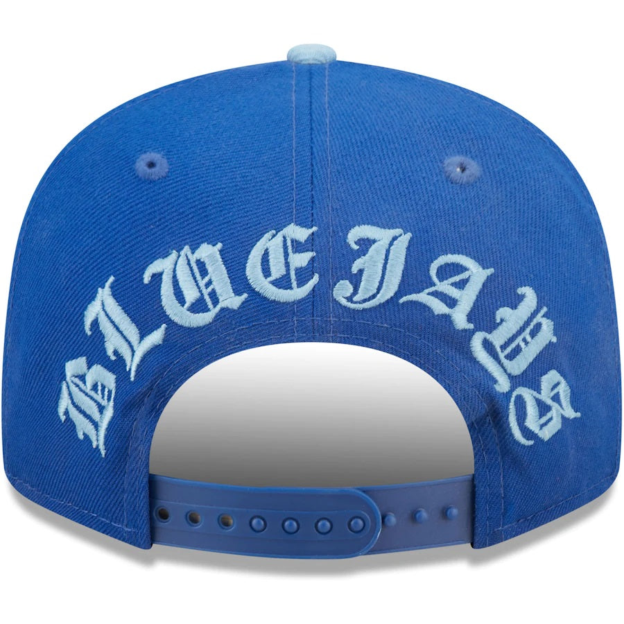 The backside of the Toronto Blue Jays Cooperstown Green Bottom Light Blue Letter Arch 9Fifty Snapback Cap | Back Word Arch Royal Blue 9Fifty
