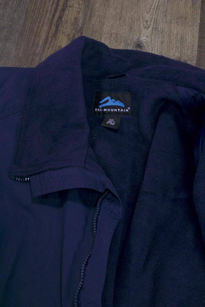 the collar of the Police Public Safety | 3 Season Dark Blue Bomber Jacket | Durable Fleece Lined Customizable Mountain Jacket is warm and fluffy