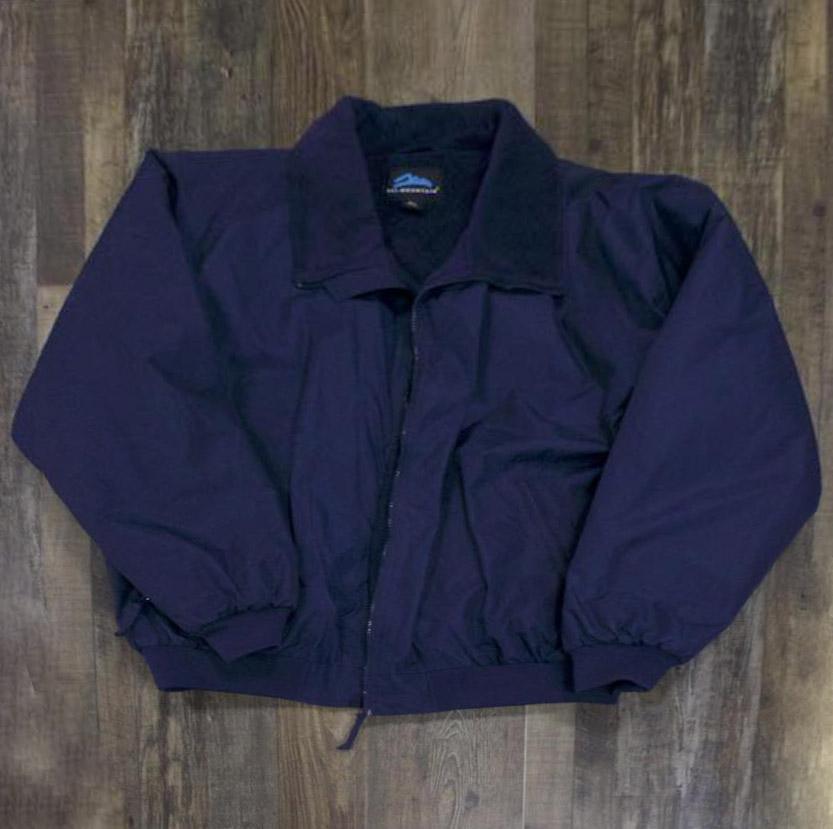 the Police Public Safety | 3 Season Dark Blue Bomber Jacket | Durable Fleece Lined Customizable Mountain Jacket has a subtly shiny nylon material with a fuzzy dark blue lining