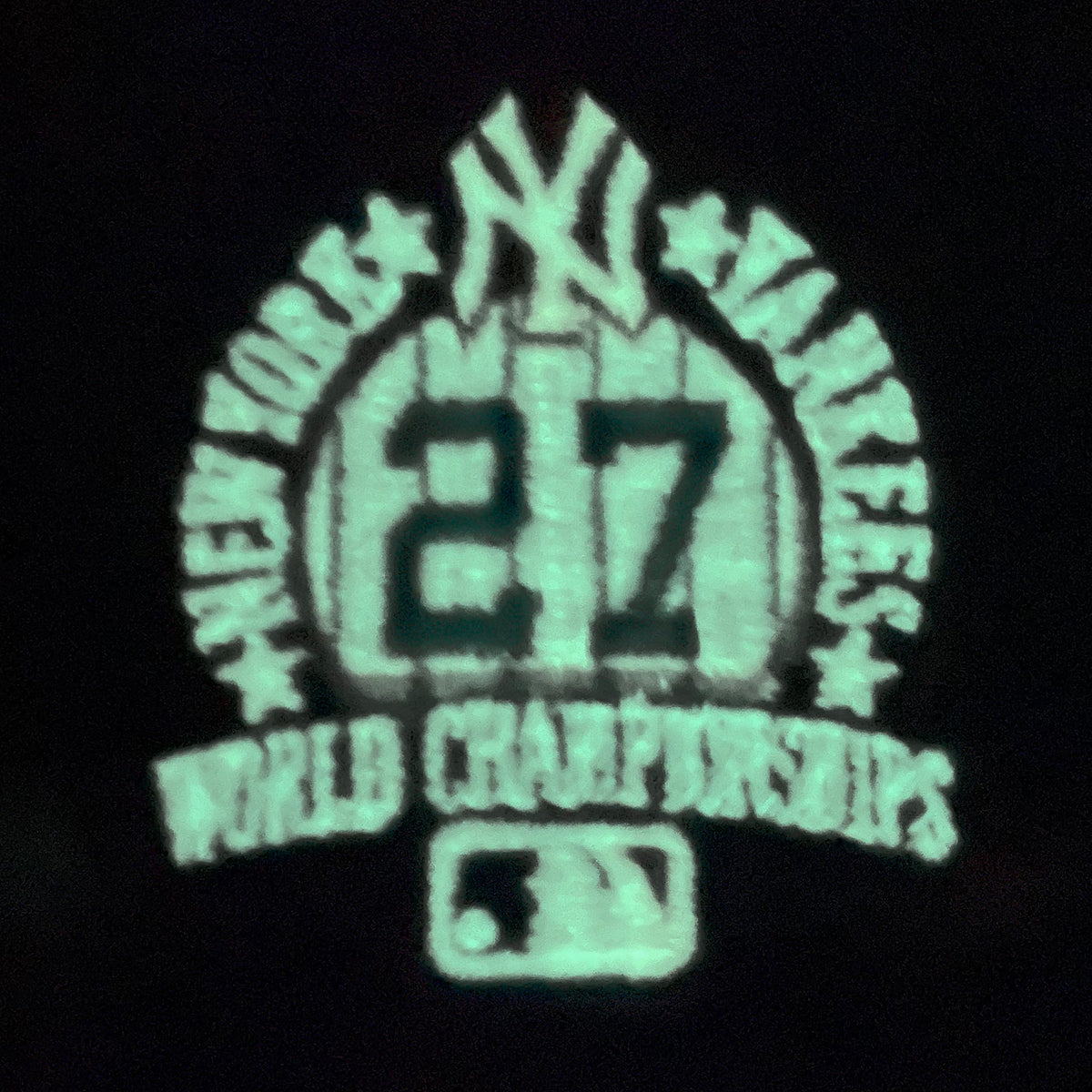 Glow in the dark side patch on the New York Yankees Glow In The Dark 27x World Series Champs Patch Pink Bottom Side Patch 59Fifty Fitted Cap